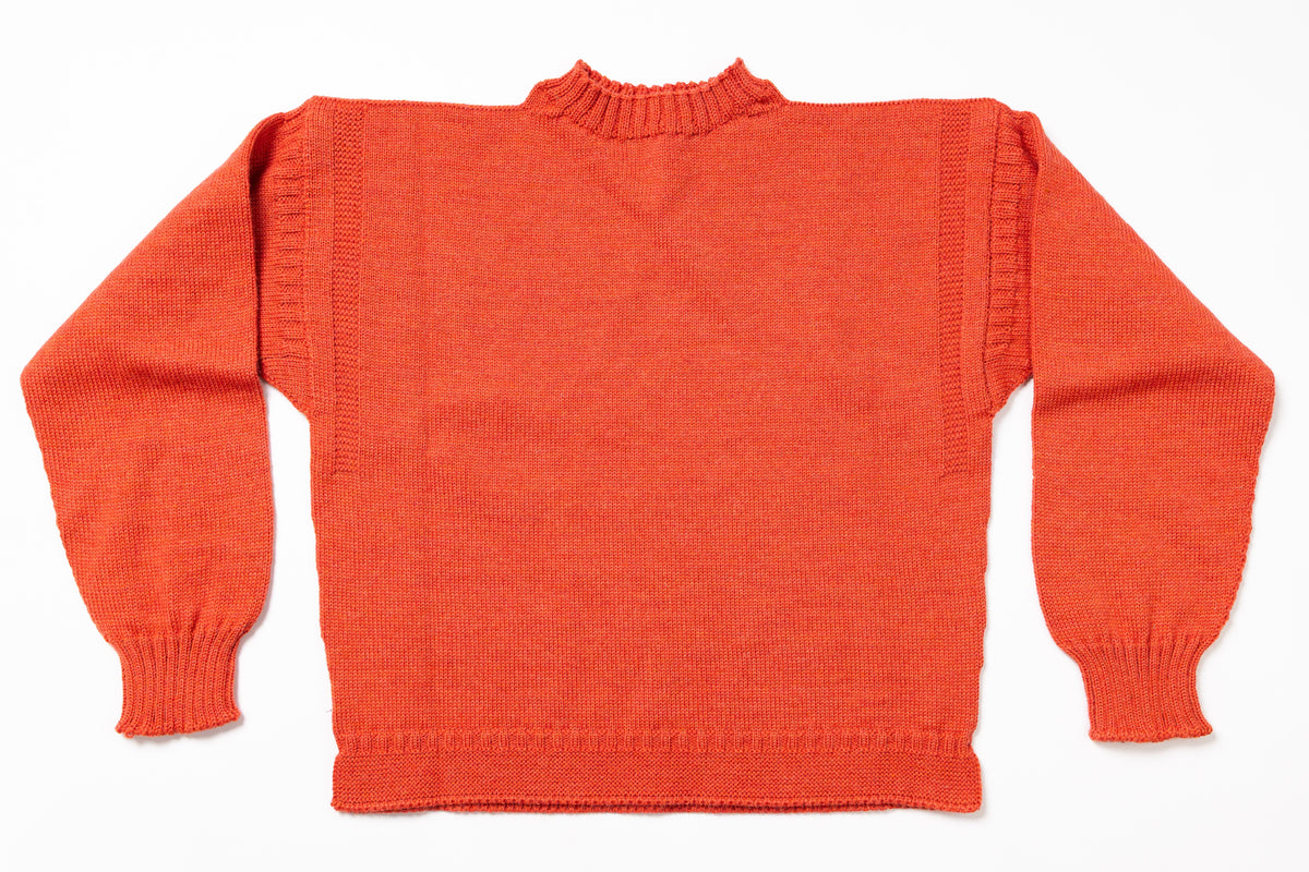 Orange sweater on a white background