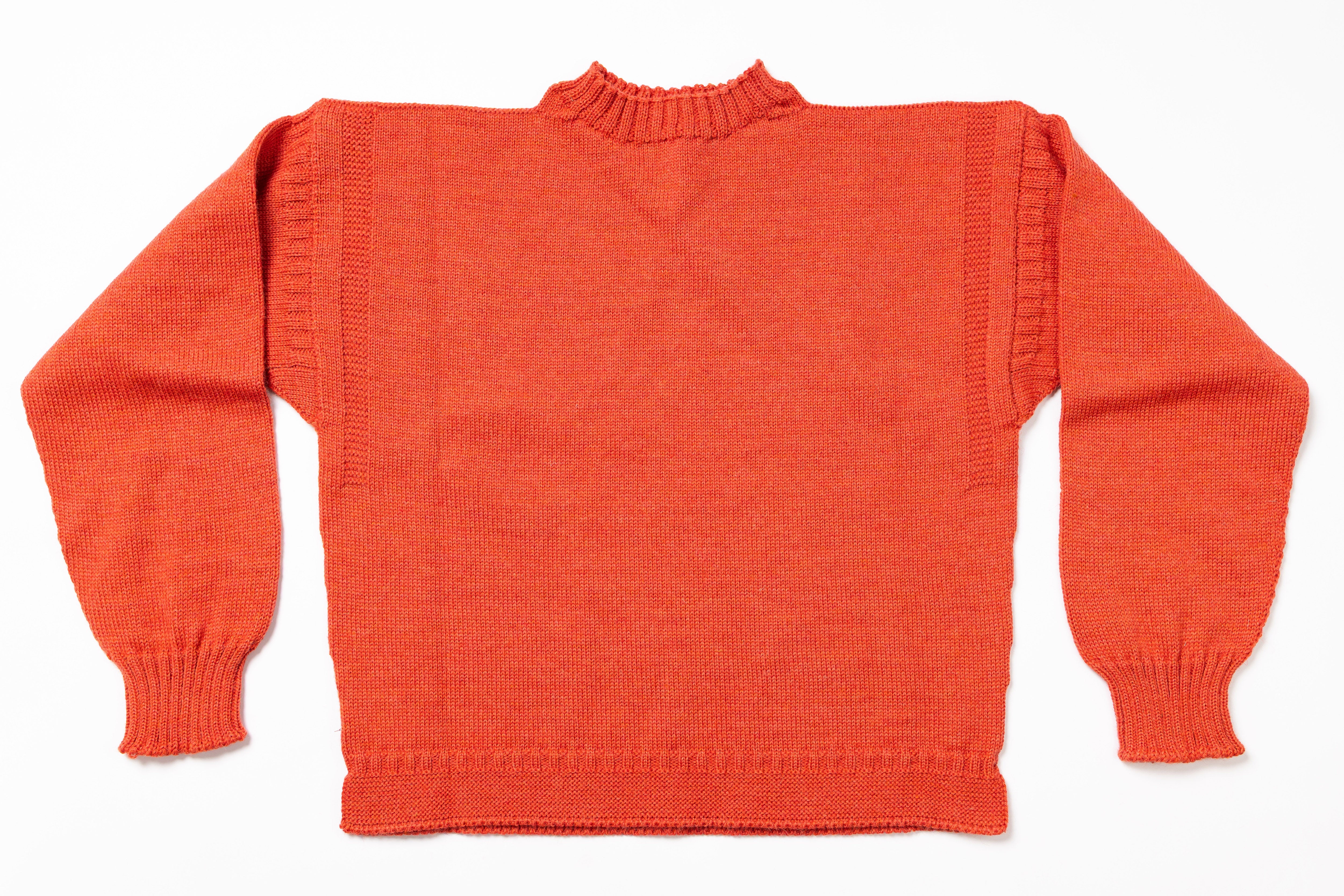 Orange sweater on a white background