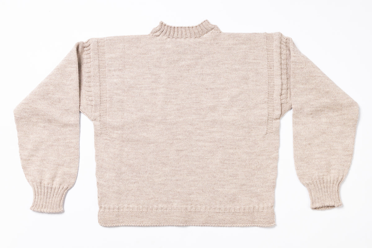 Beige knitted sweater on a white background