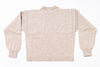 Beige knitted sweater on a white background