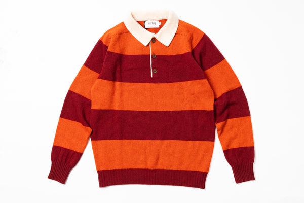 Orange and red striped sweater with a white collar on a white background
