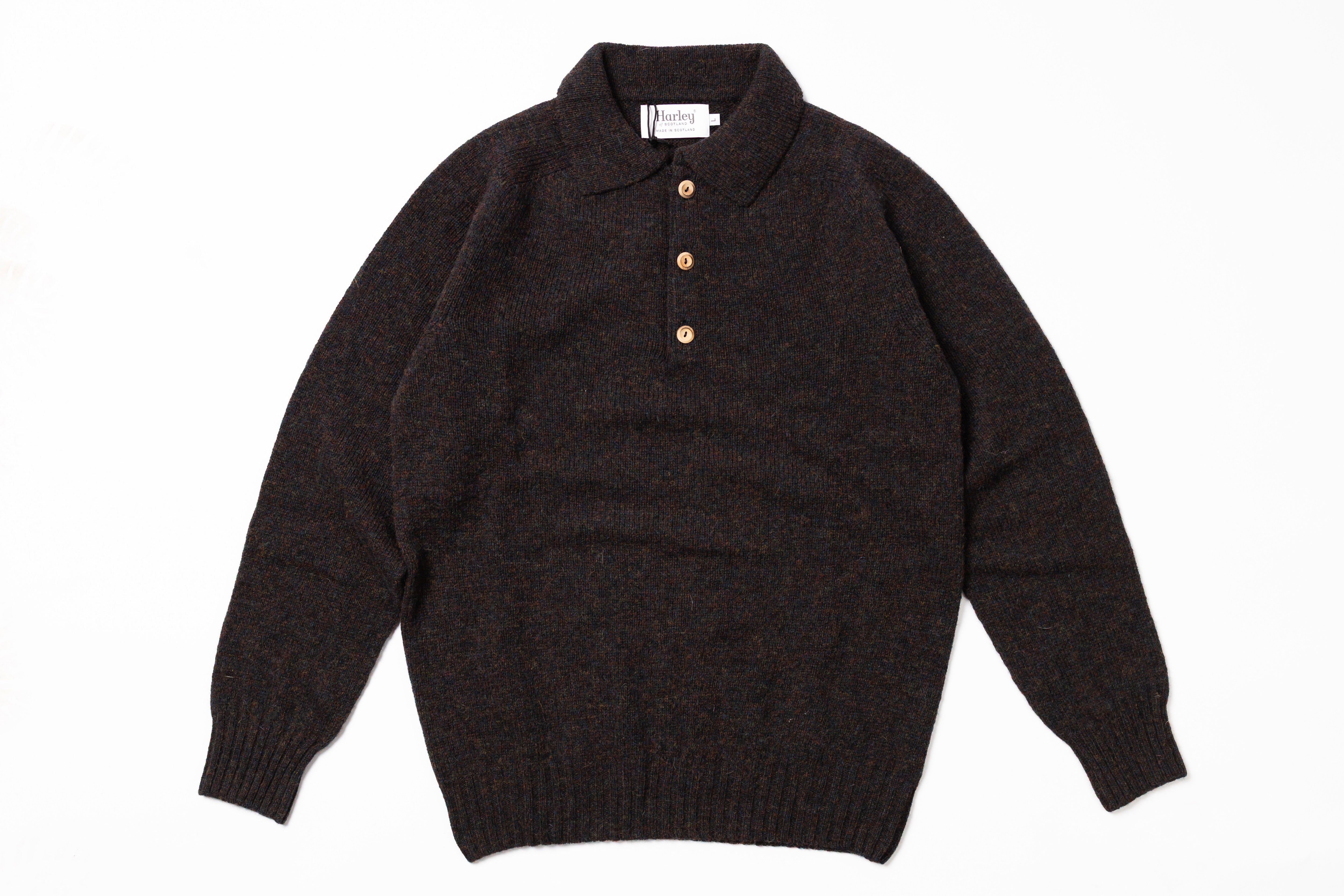 Dark sweater with a collar on a white background