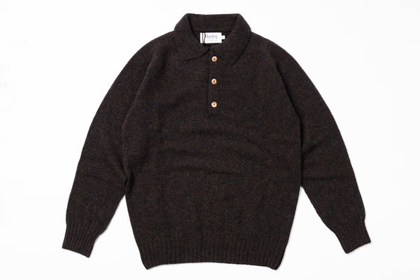 Dark sweater with a collar on a white background