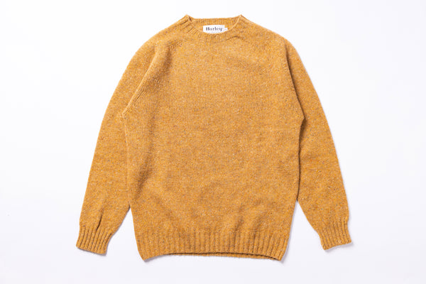 Yellow sweater on white background