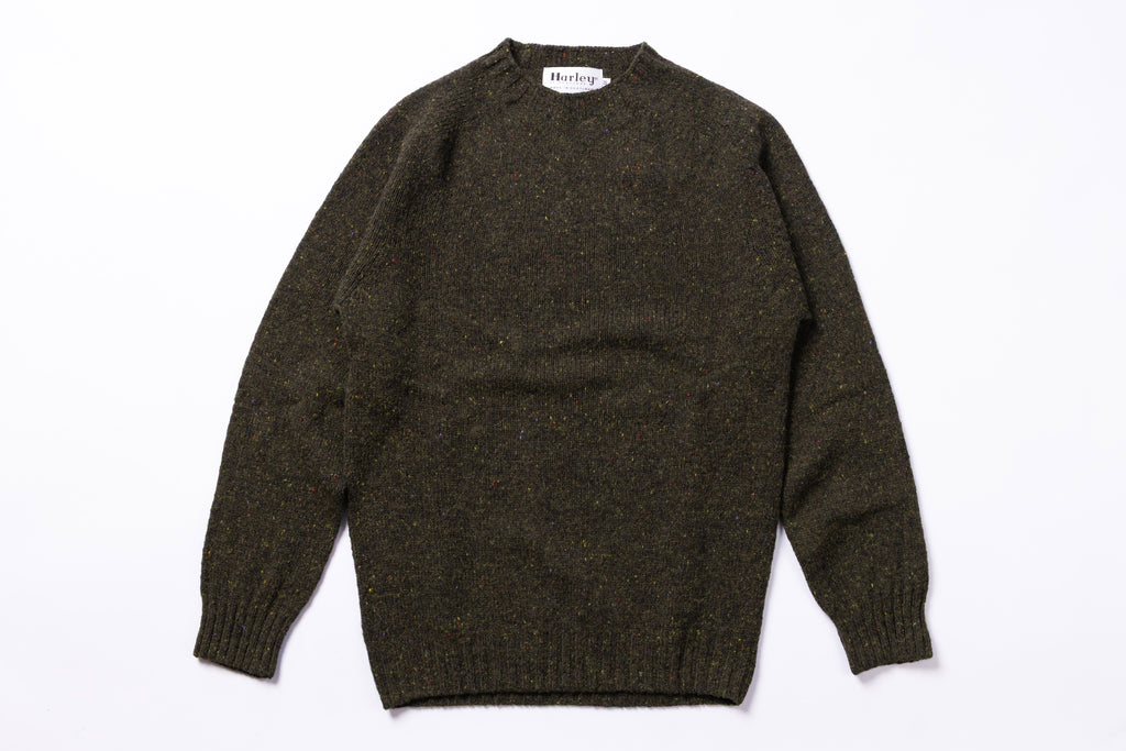 Green sweater on white background