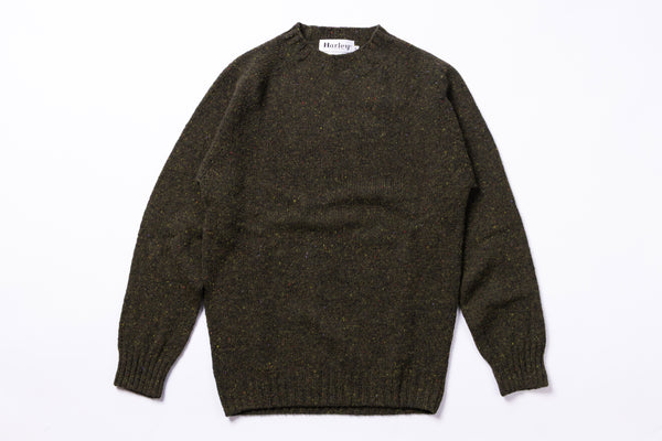 Green sweater on white background