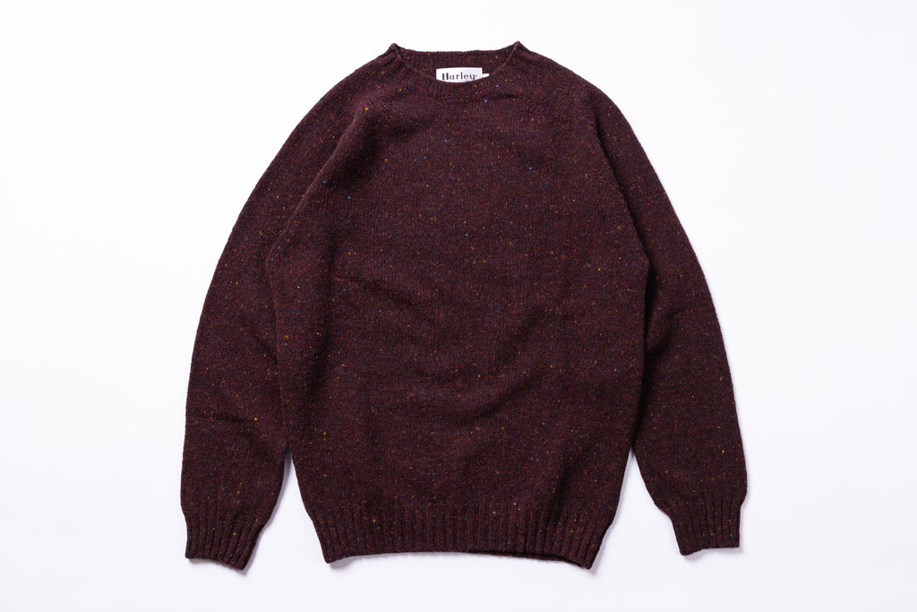 Burgundy sweater on a white background