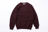 Burgundy sweater on a white background