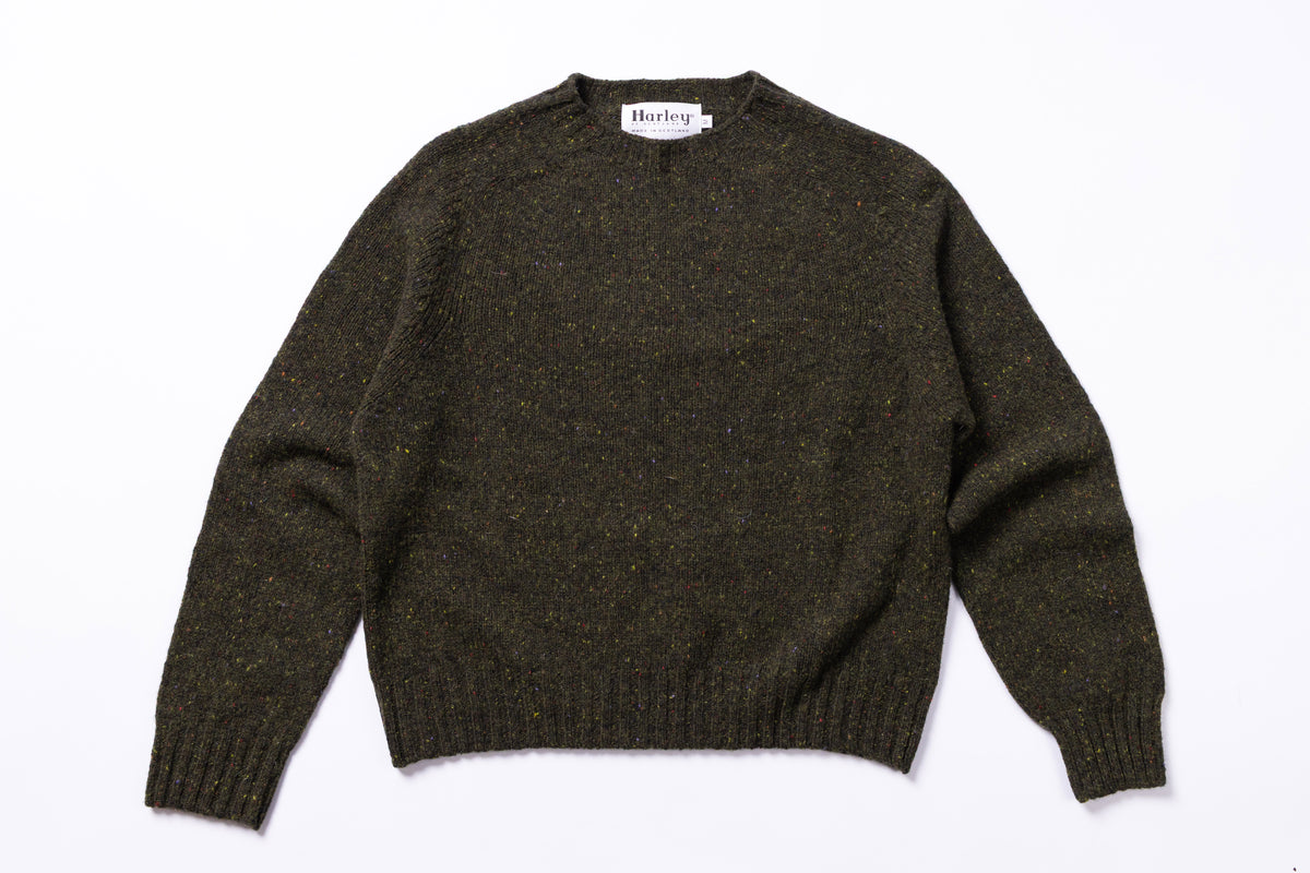 Dark Green sweater with 'Harley' label on a white background
