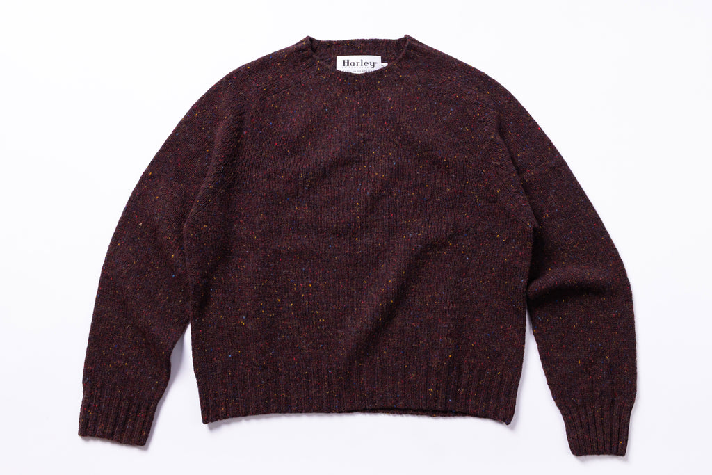Burgundy sweater with 'Harley' label on a white background