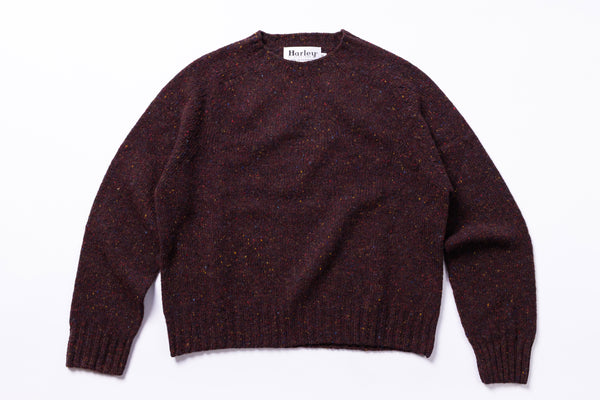 Burgundy sweater with 'Harley' label on a white background