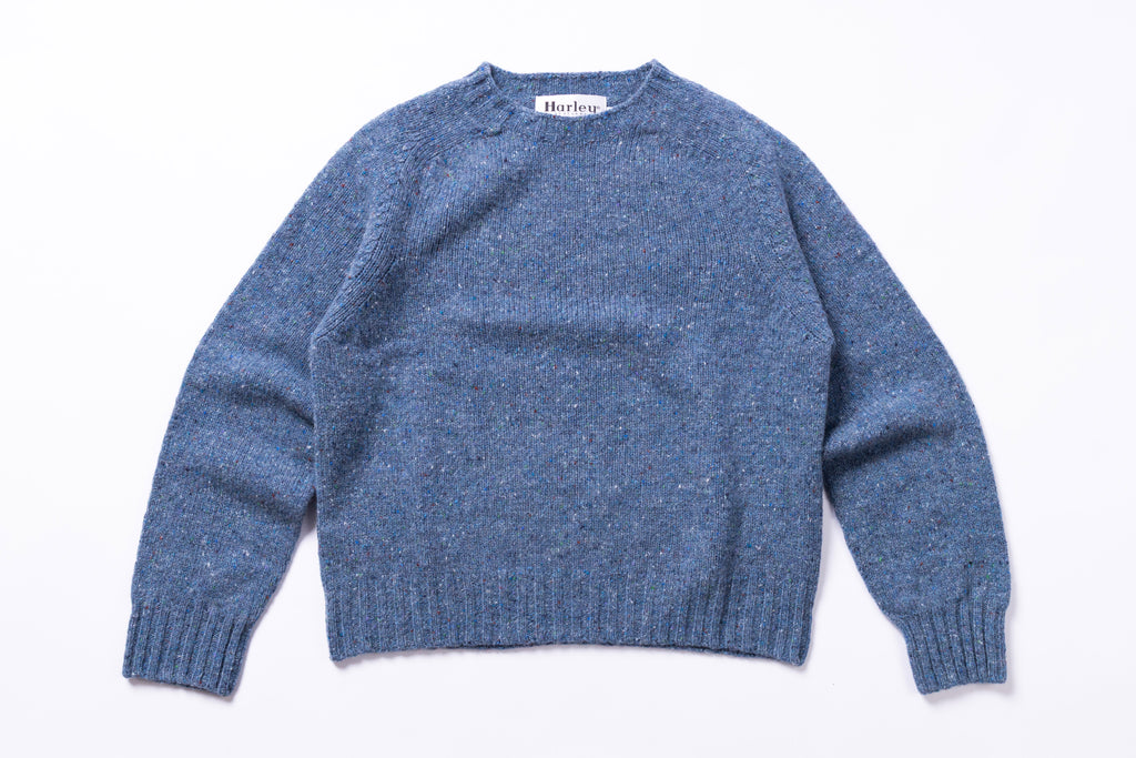Light blue sweater with 'Harley' label on a white background