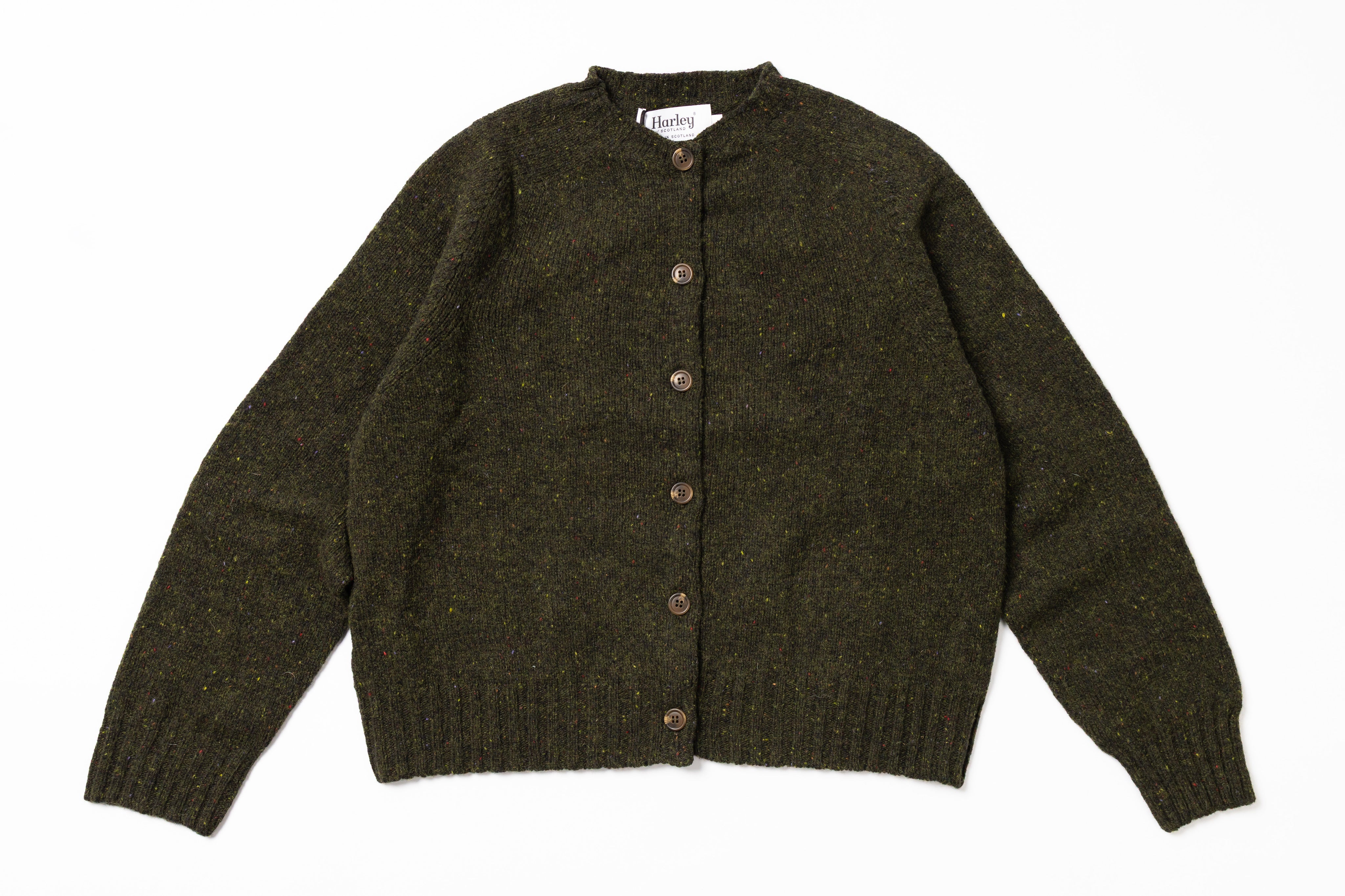 Green knitted cardigan on a white background