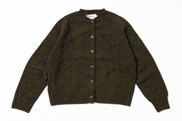 Green knitted cardigan on a white background