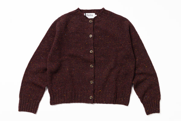 Brown knitted cardigan with buttons on a white background