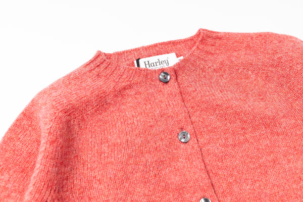 Pink cardigan on a white background