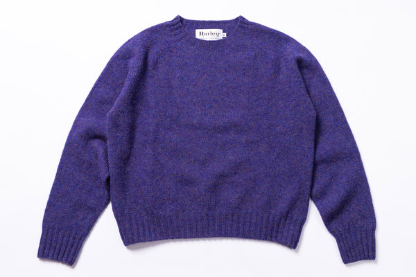 Purple sweater with 'Harley' label on a white background