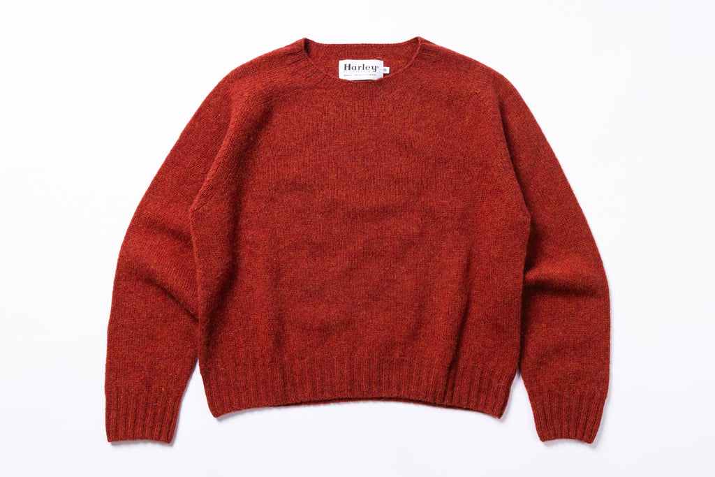 Red sweater with 'Harley' label on a white background