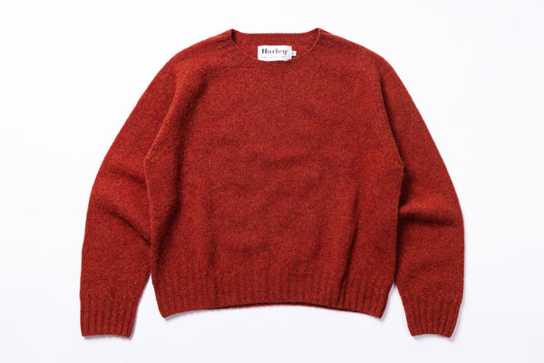 Red sweater with 'Harley' label on a white background