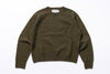 Green sweater with 'Harley' label on a white background