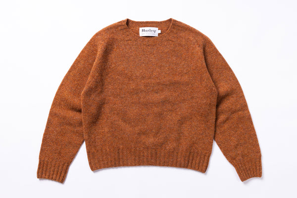 Brown sweater with 'Harley' label on a white background