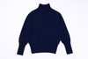 Navy blue turtleneck sweater on a white background