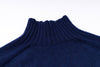 Close-up of a blue ribbed sweater collar on a white background