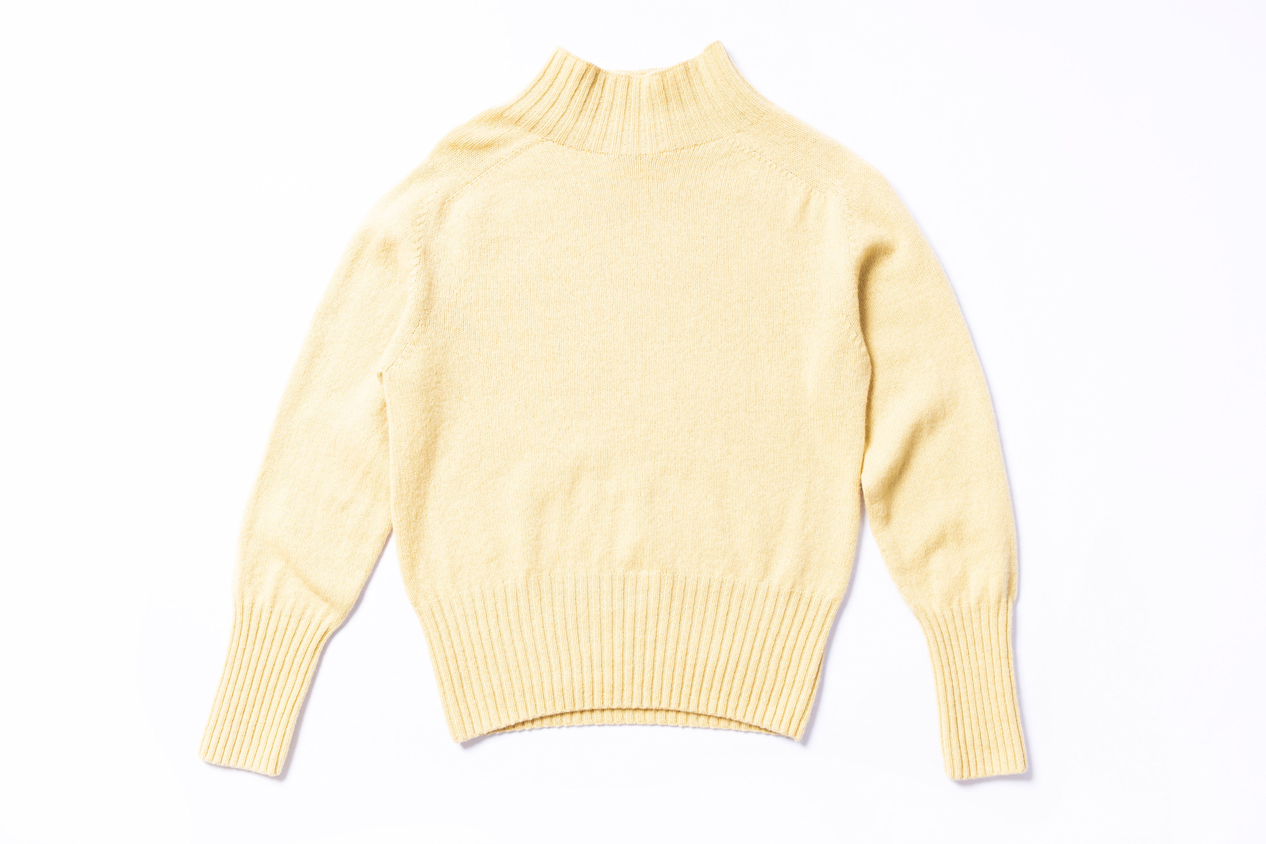 Yellow sweater on a white background