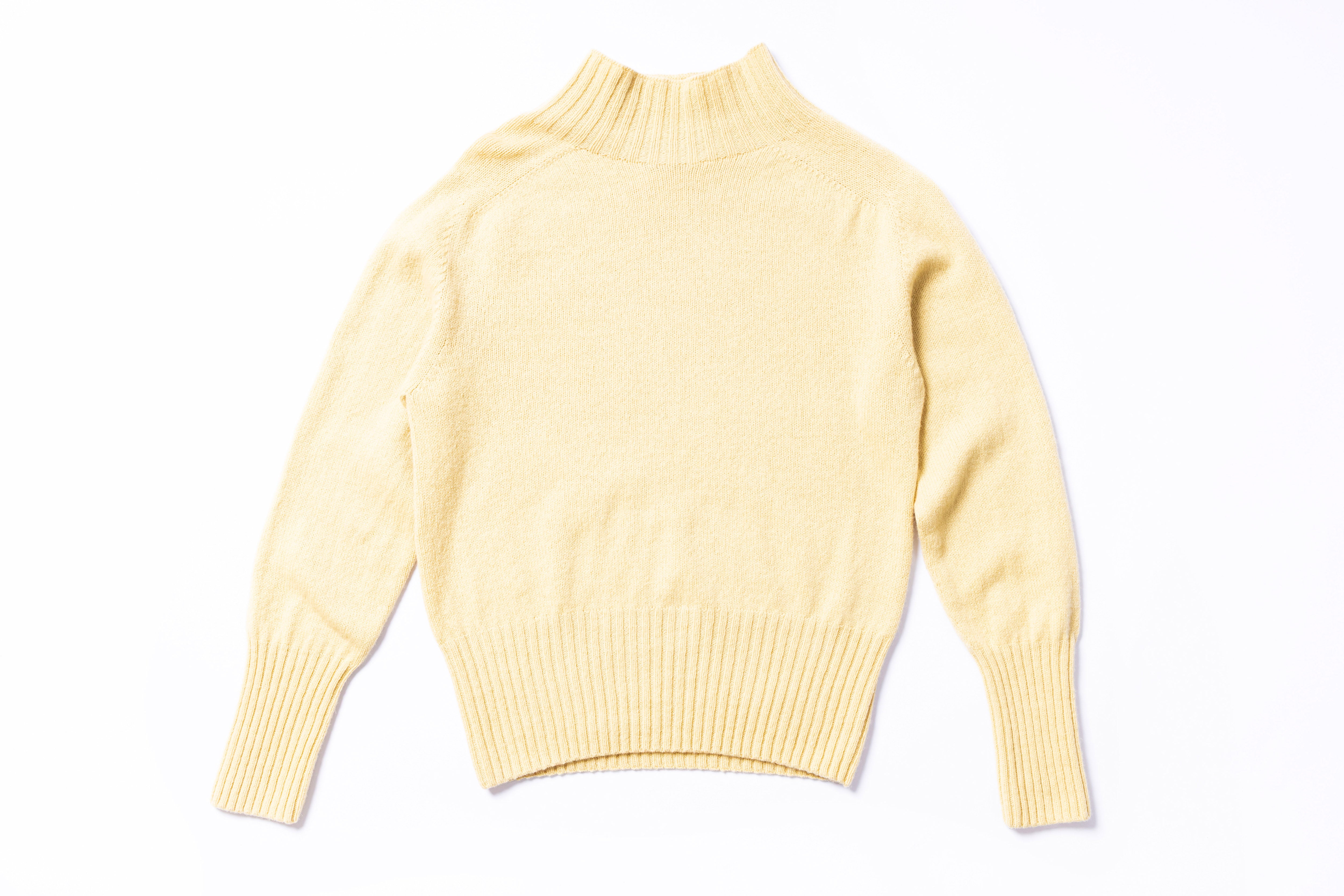 Yellow sweater on a white background
