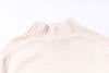Close-up of a beige sweater collar on a white background