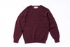 Maroon sweater on a white background