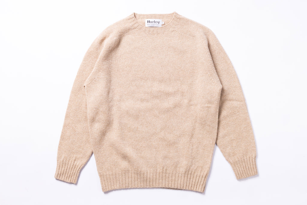 Cream sweater on white background