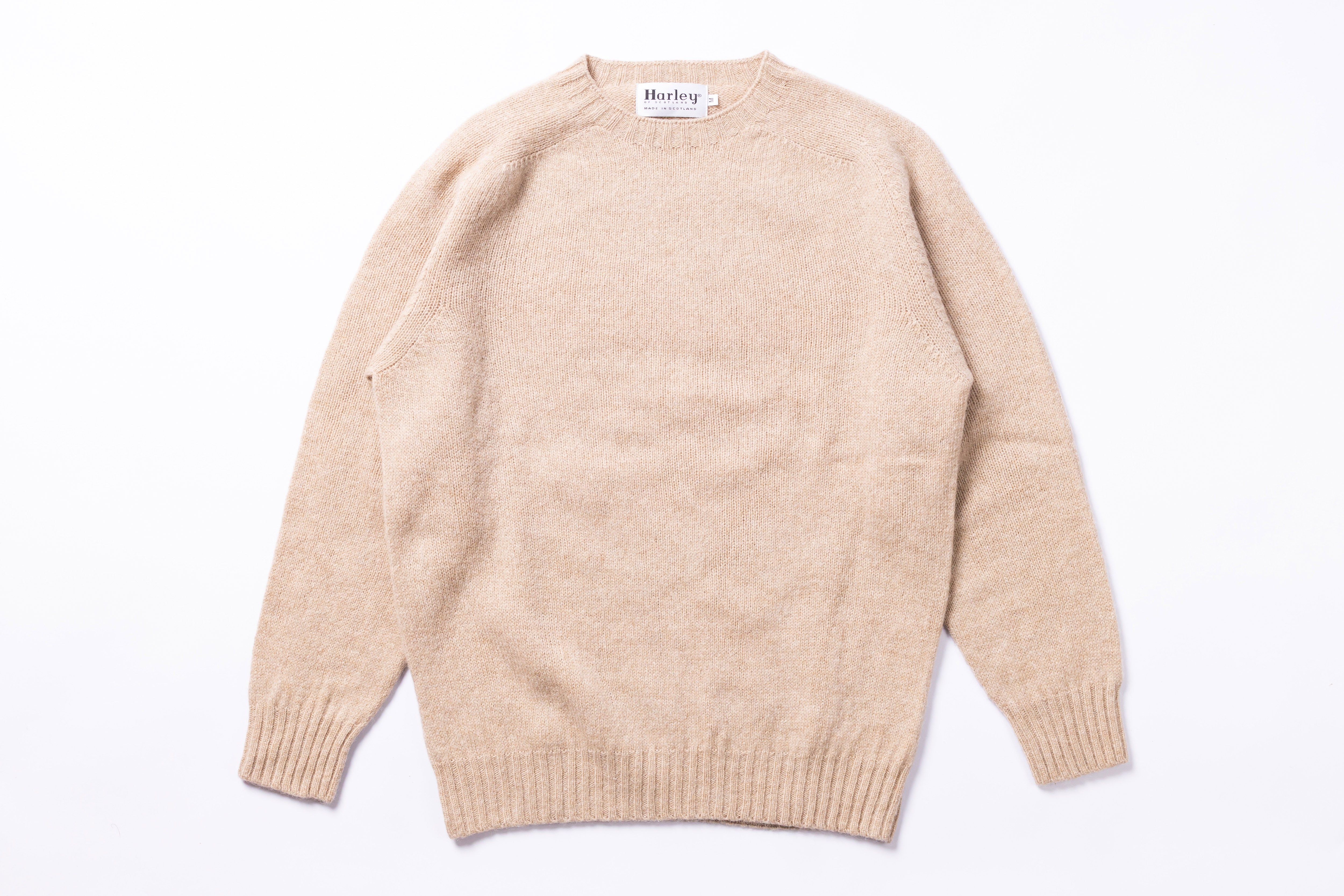 Cream sweater on white background