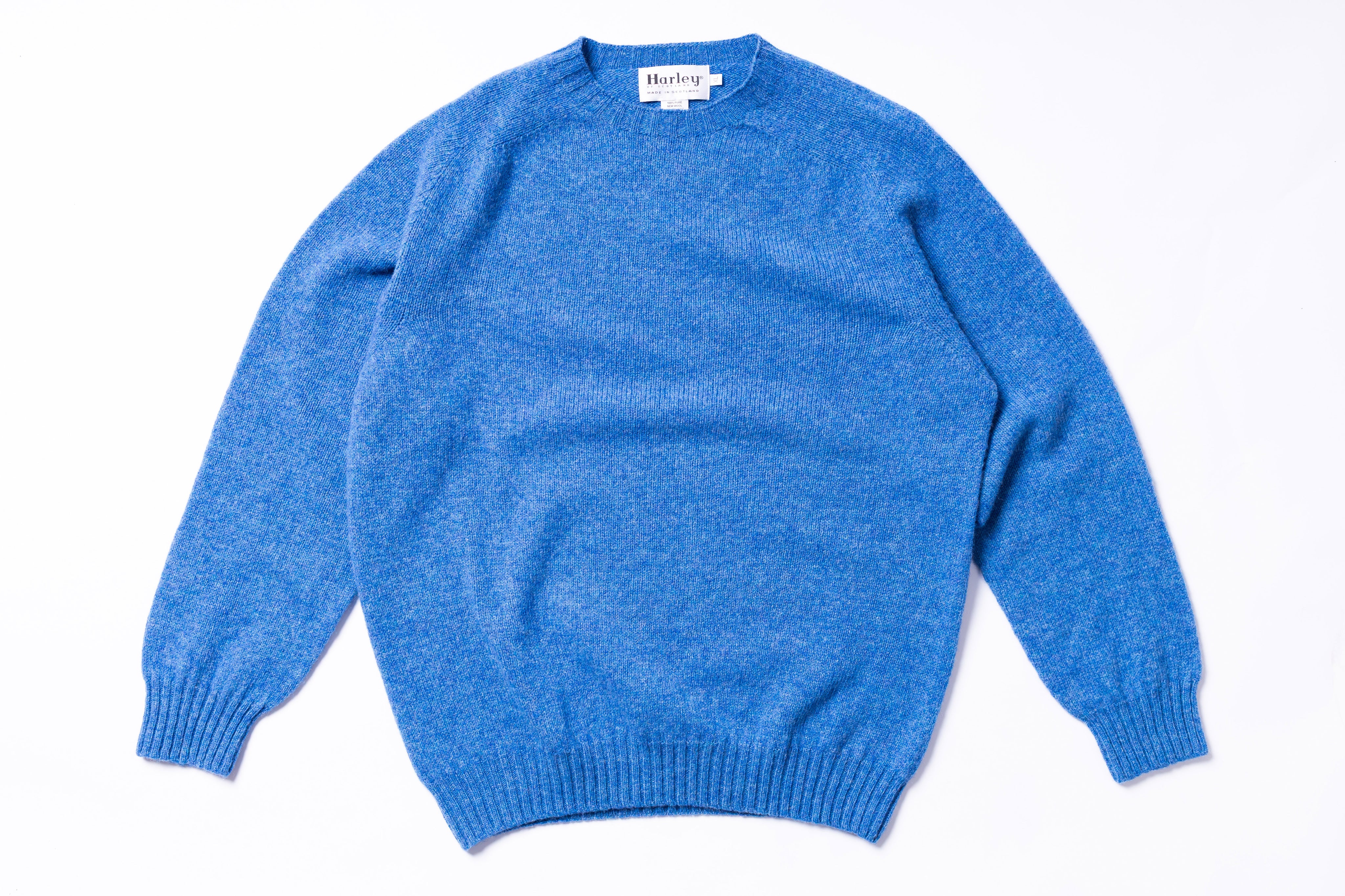Blue sweater on a white background