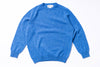 Blue sweater on a white background