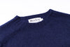 Navy blue sweater with a Harley label on a white background