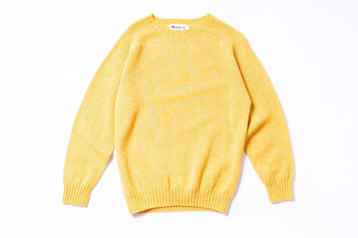 Yellow sweater on a white background
