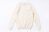 Cream-colored sweater on a white background