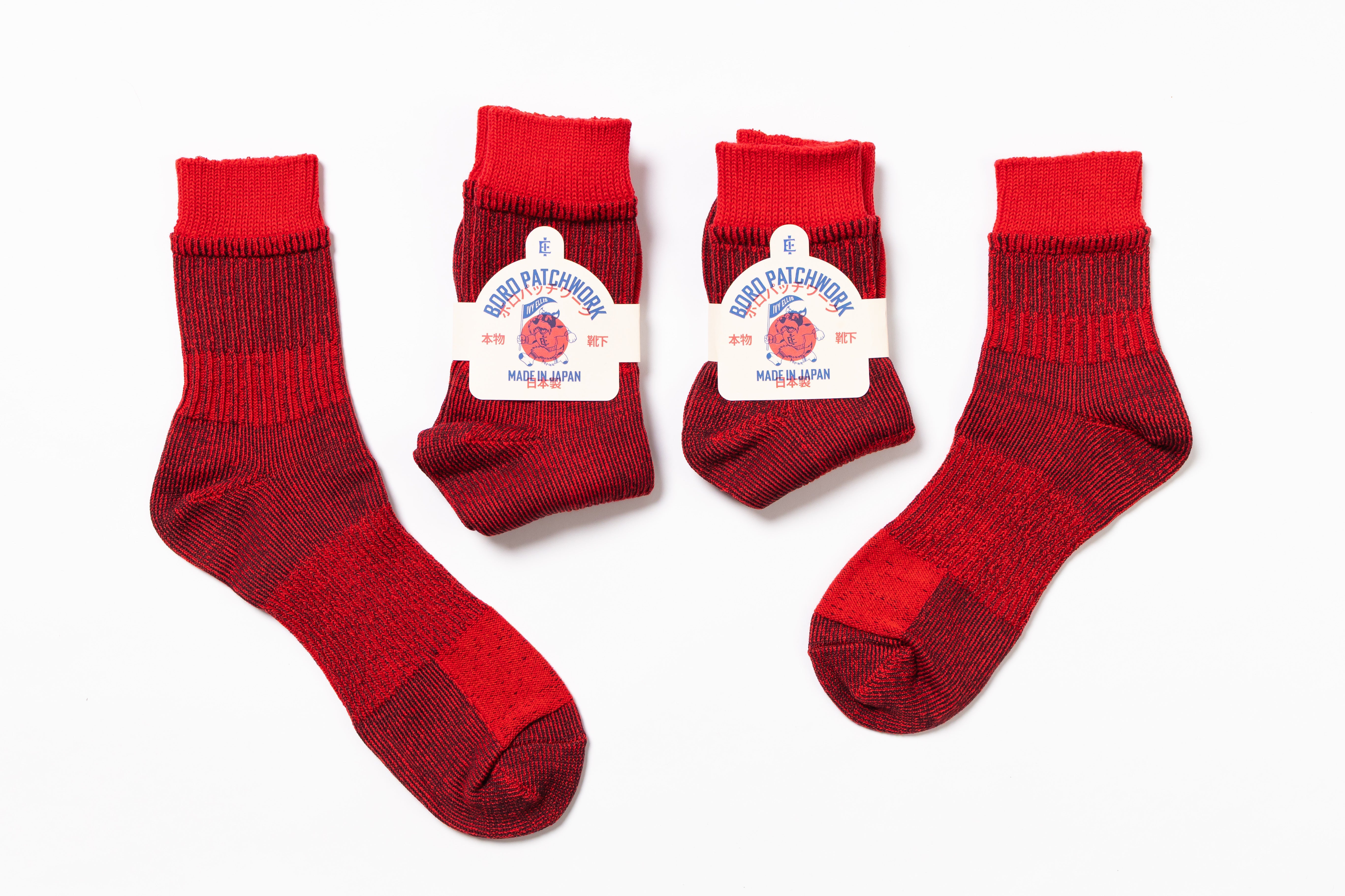 Red socks with a brand label on a white background