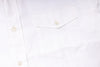 Close-up of a white shirt with buttons on a white background