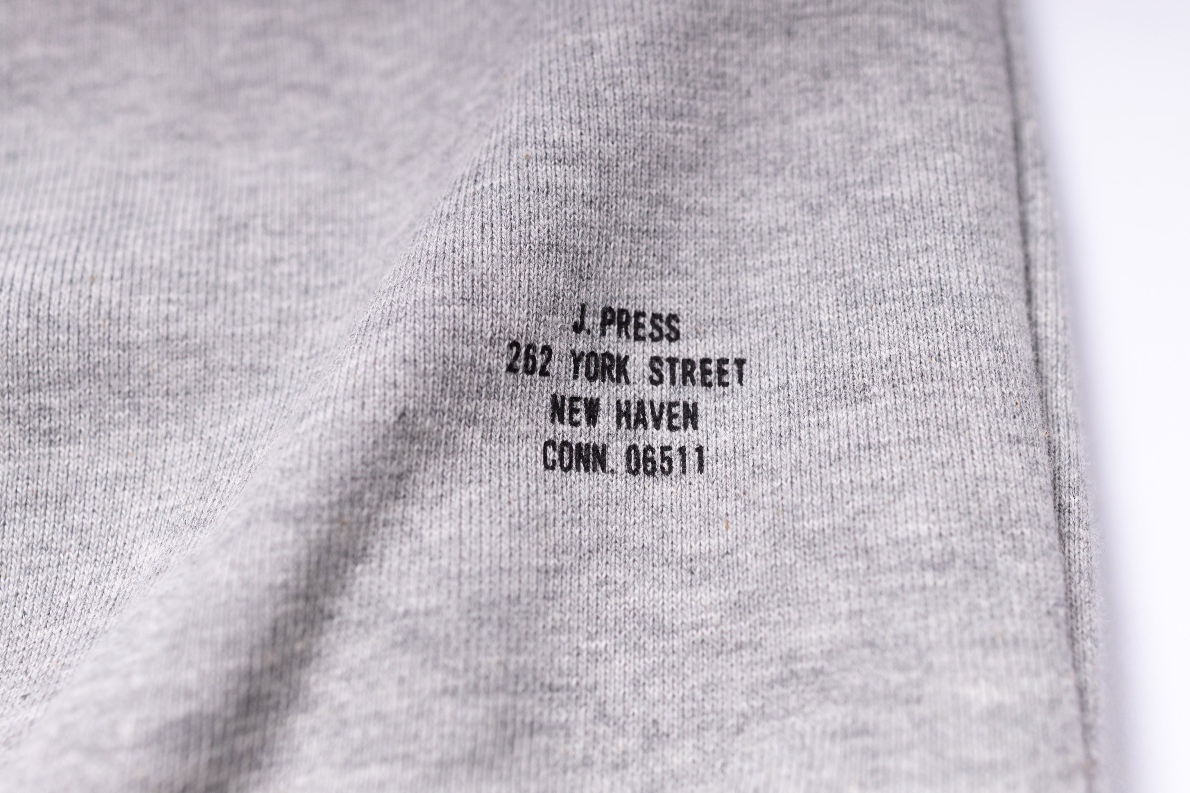 Gray fabric with black text label on a white background