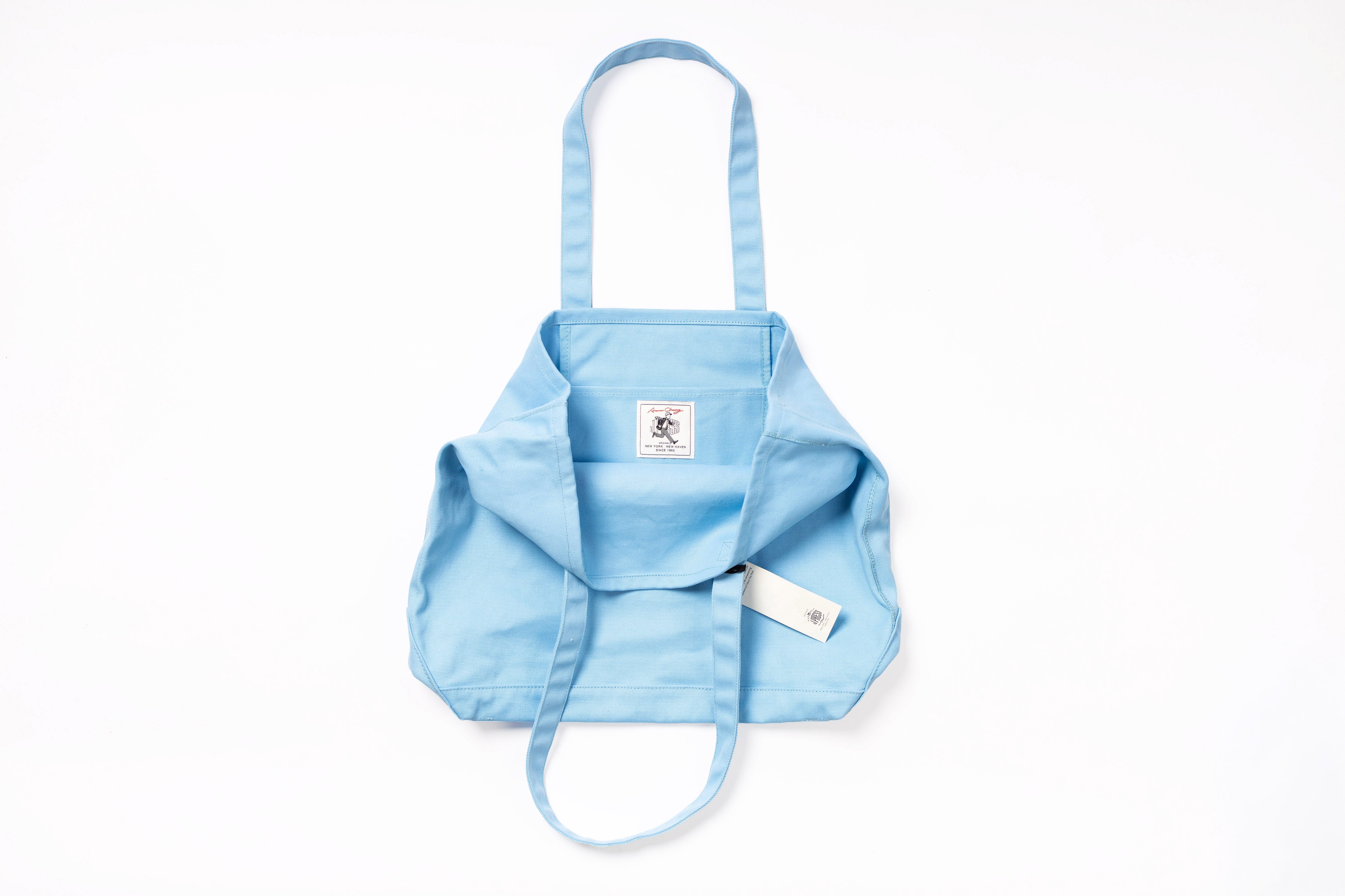 Light blue baby carrier with straps on a white background