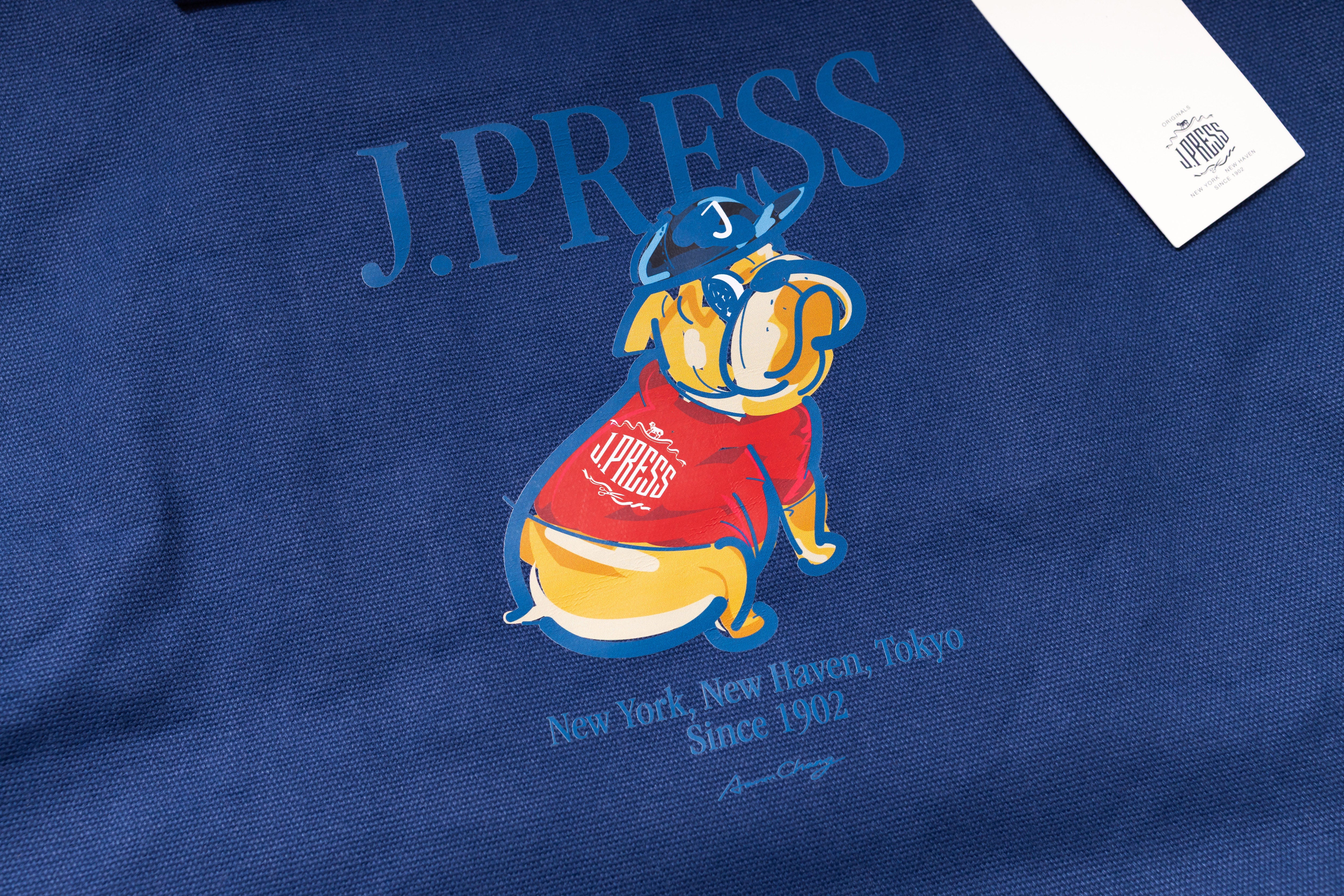 Blue shirt with J. Press logo featuring a bulldog in a red sweater.