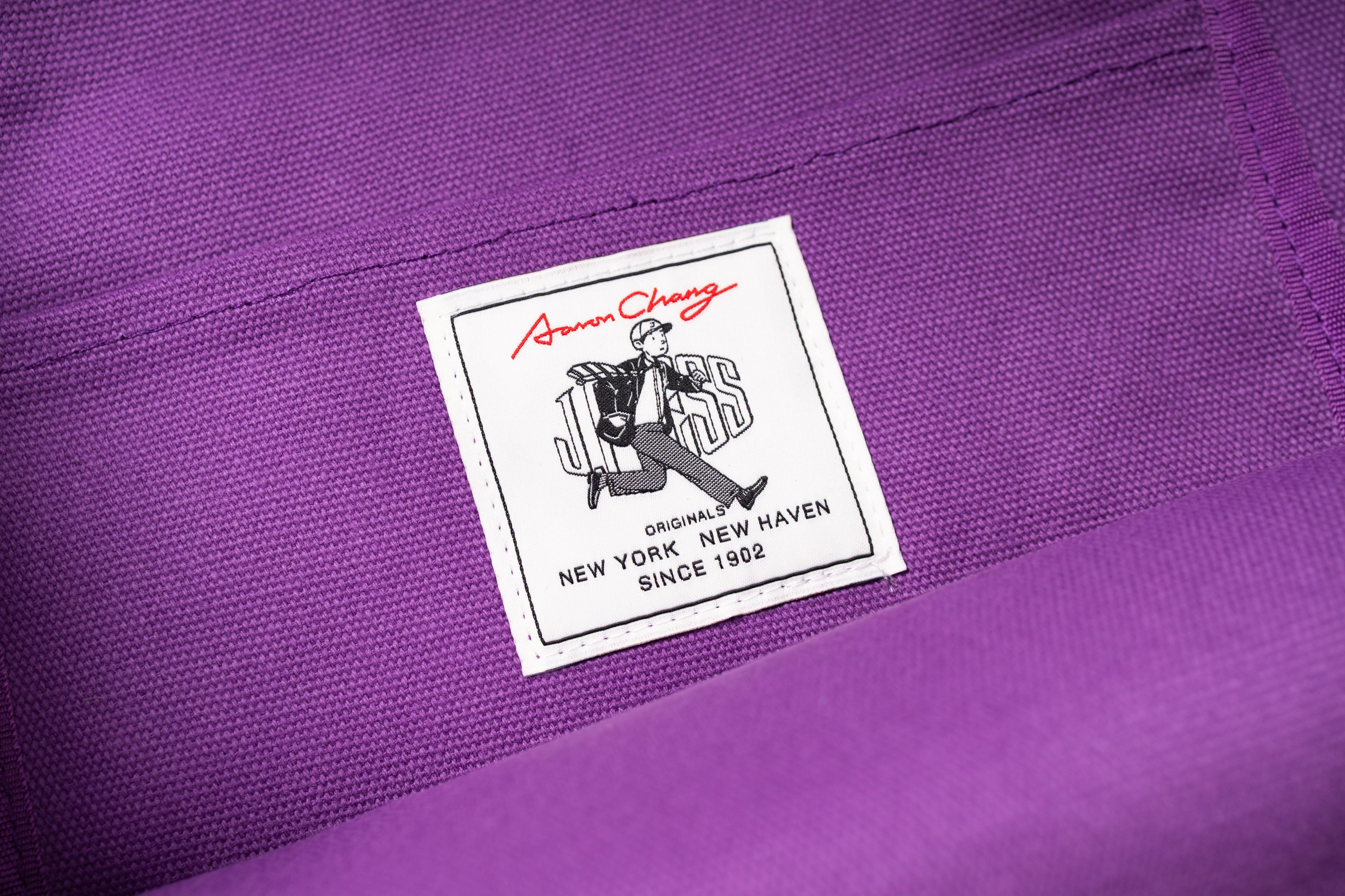 Close-up of a label on a purple fabric background