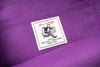 Close-up of a label on a purple fabric background