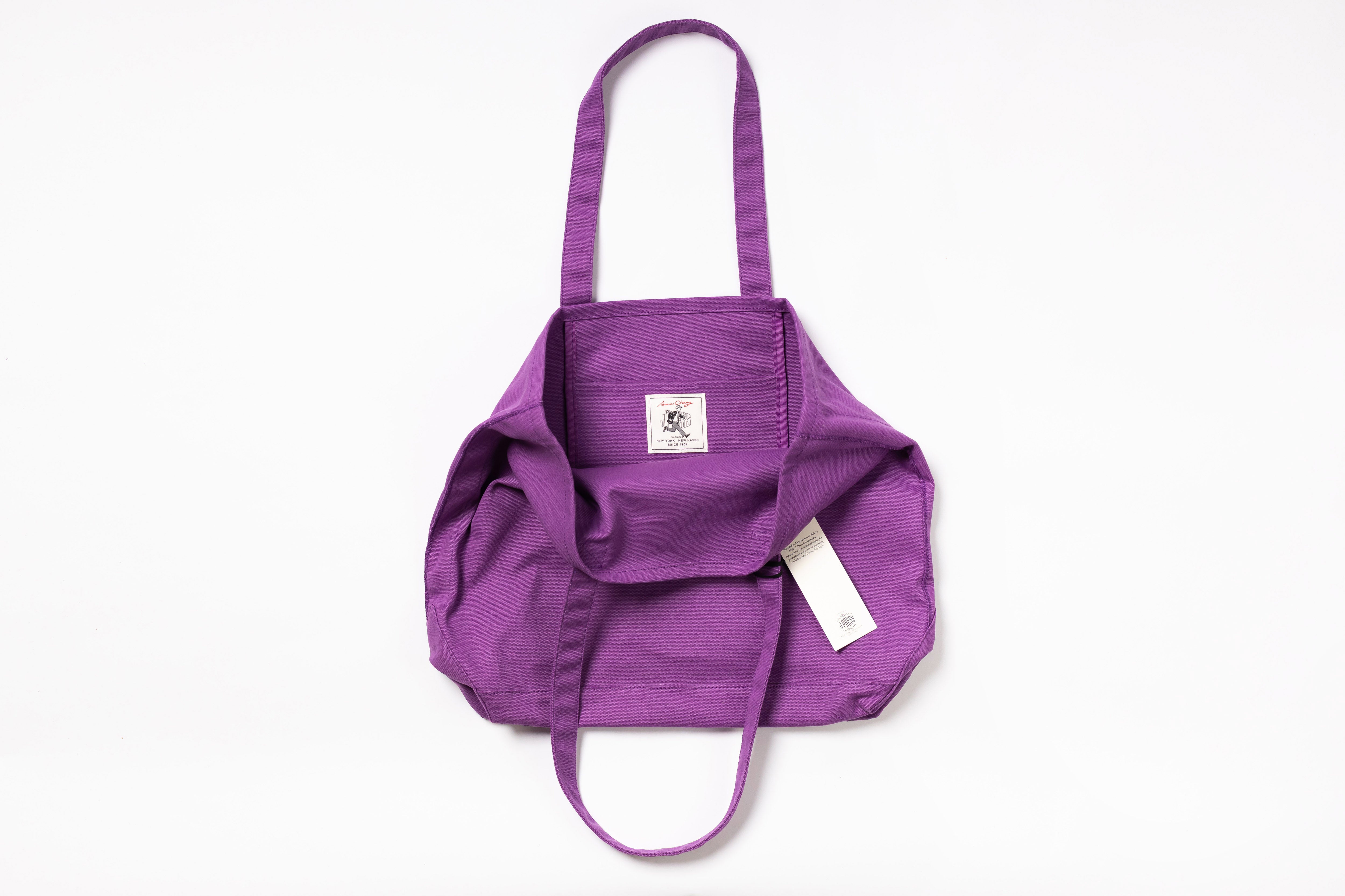 Purple bag with a visible brand logo on a white background