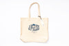Beige tote bag with a logo and text on a white background