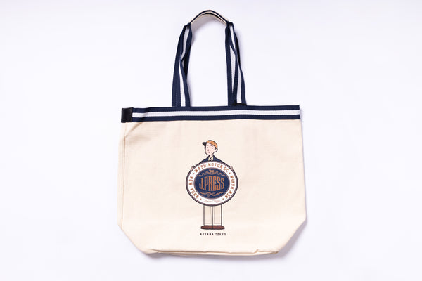 Beige tote bag with black straps featuring a logo on a white background