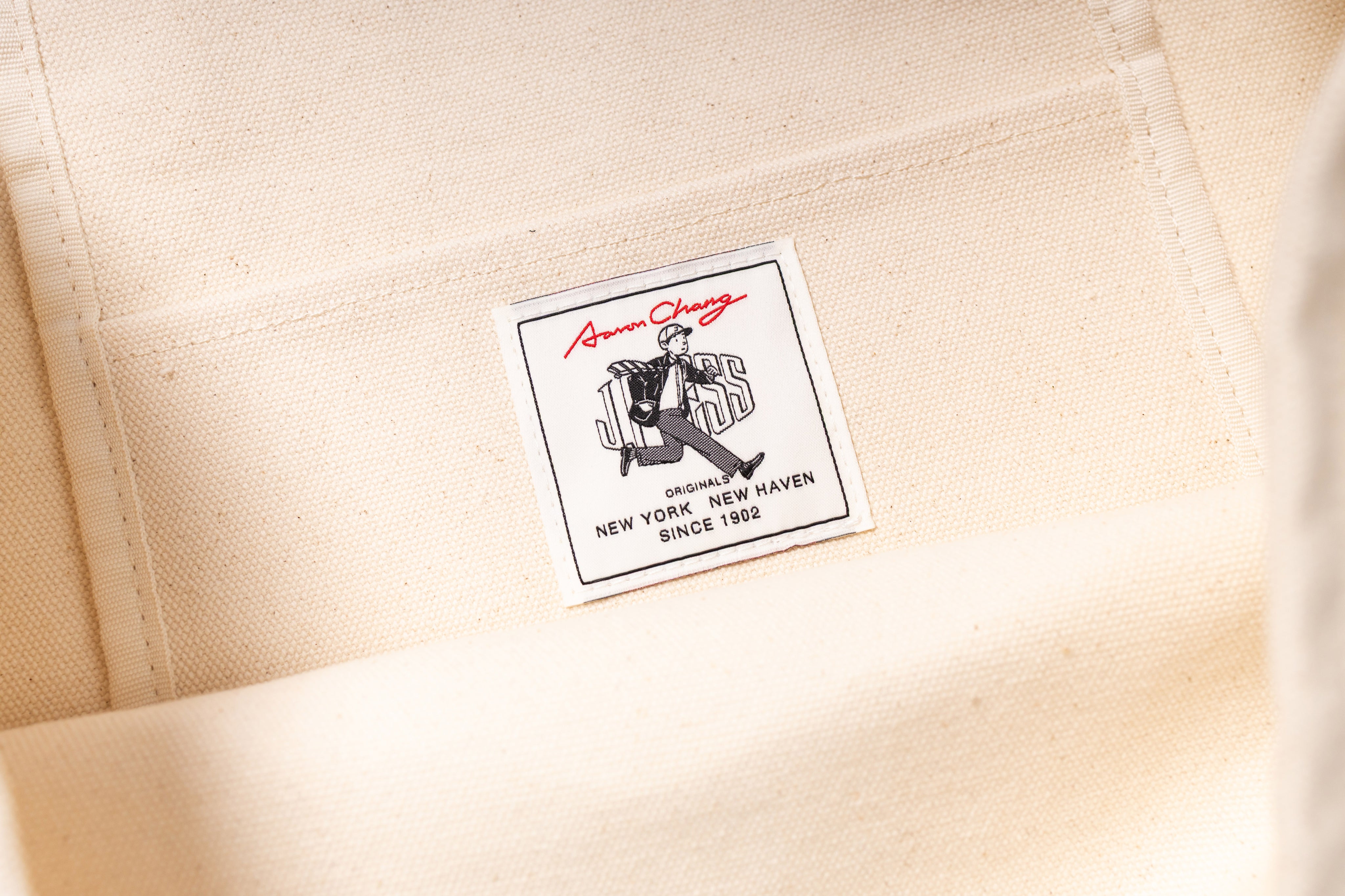 Close-up of a label on a beige fabric background