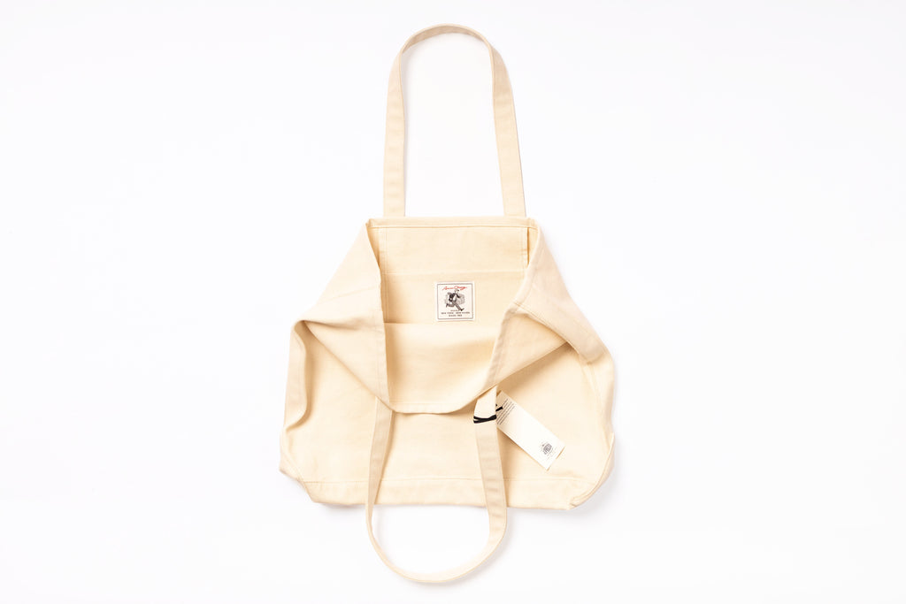 Beige backpack on a white background